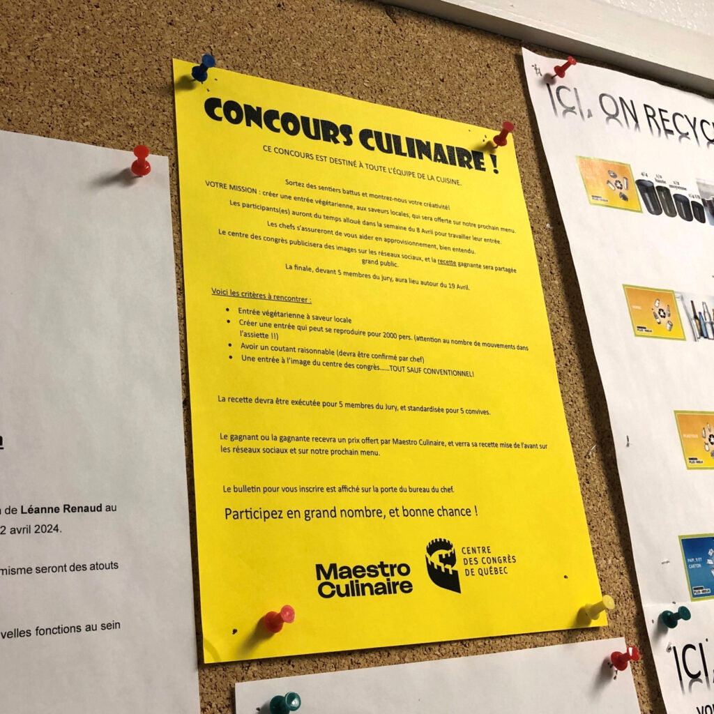 Poster of the Maestro Culinaire contest hanging on a bulletin board